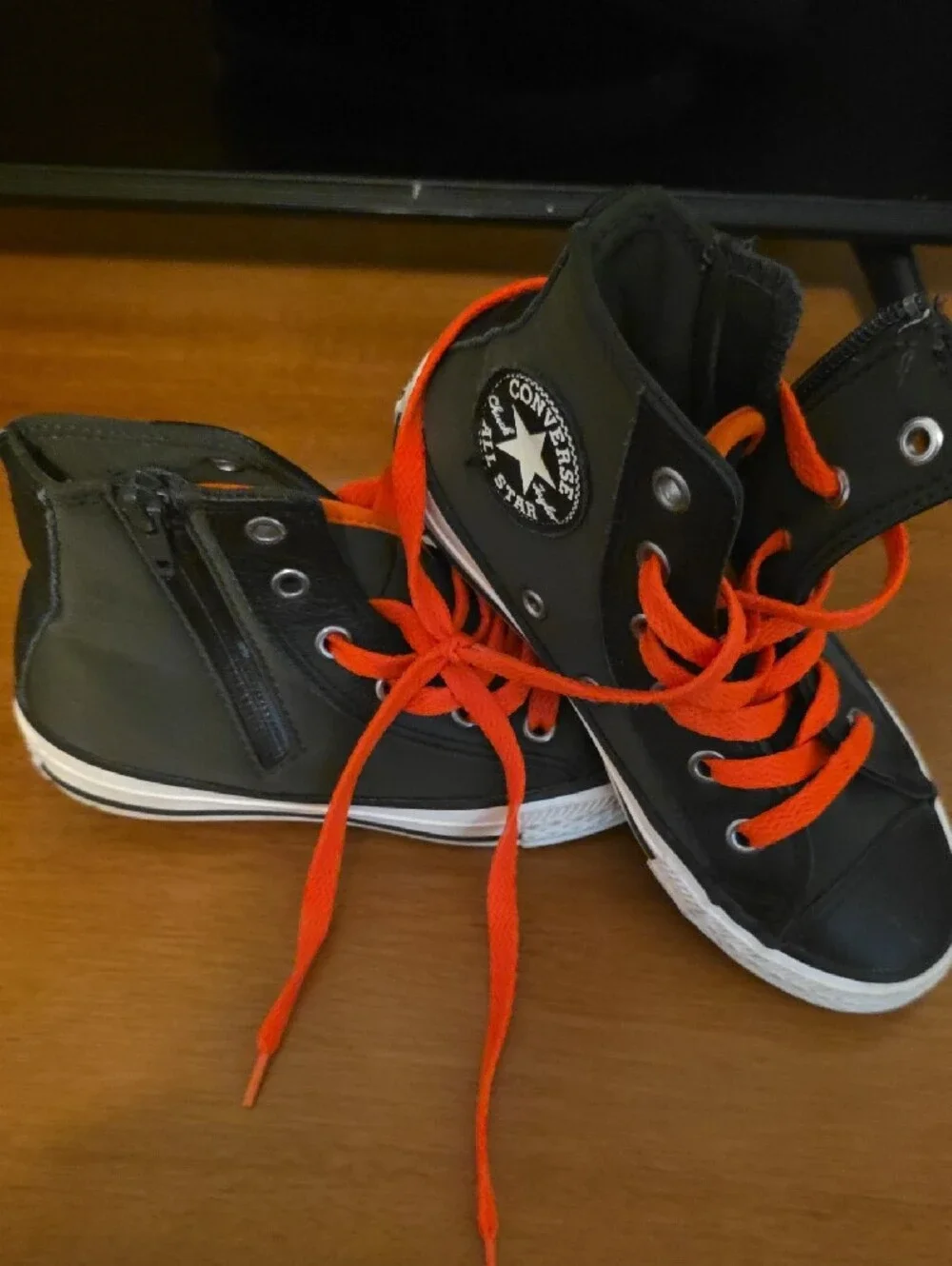 Converse Kids Black High-Top Sneakers with Bright Orange Laces